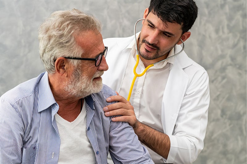 doctor checking patient with osteoporosis