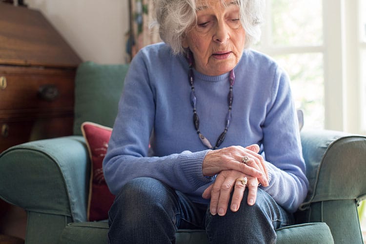 elderly showing symptoms of parkinsons disease