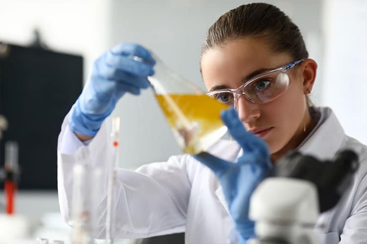 researcher checking cbd oil in a lab