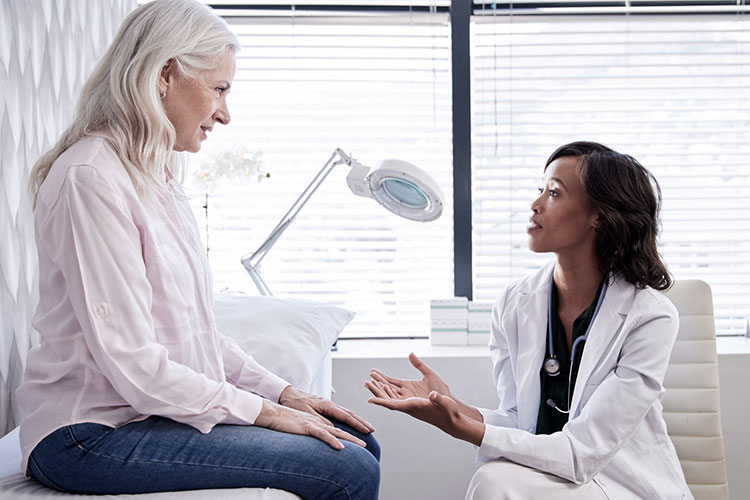 a doctor telling the benefits of cbd oil to her patient