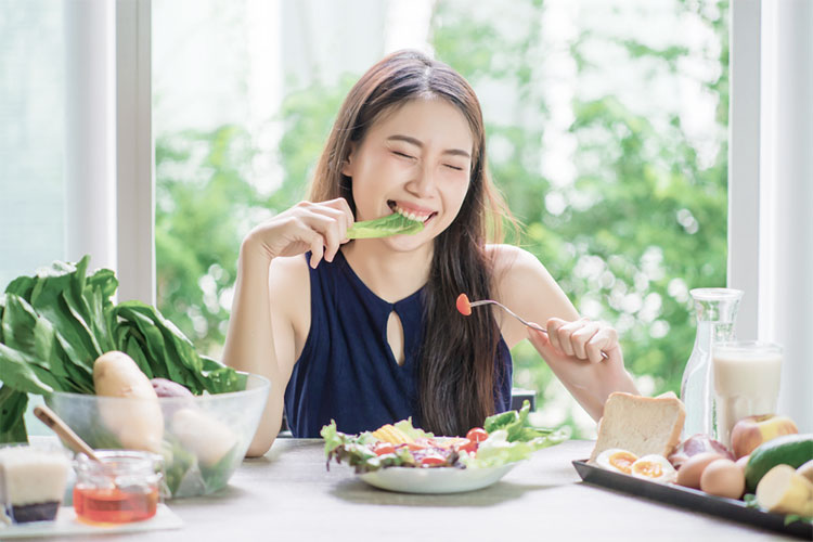 happy woman having an appetite after taking cbd oil