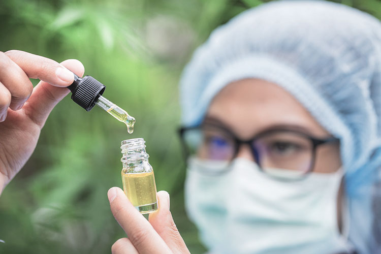 researcher checking the potency of a cbd tincture
